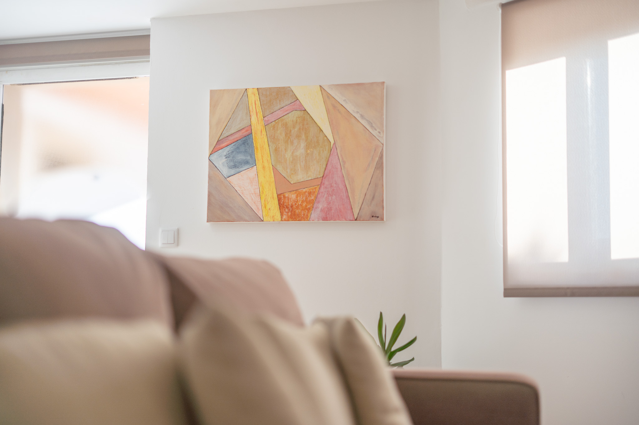 Painting above the Studio sofa beside the window