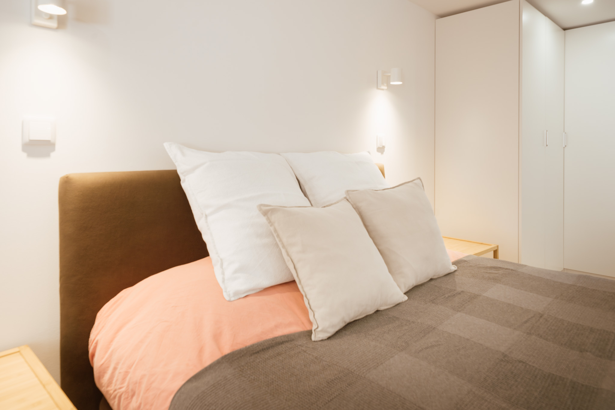 Studio double bed with reading lights and wardrobe