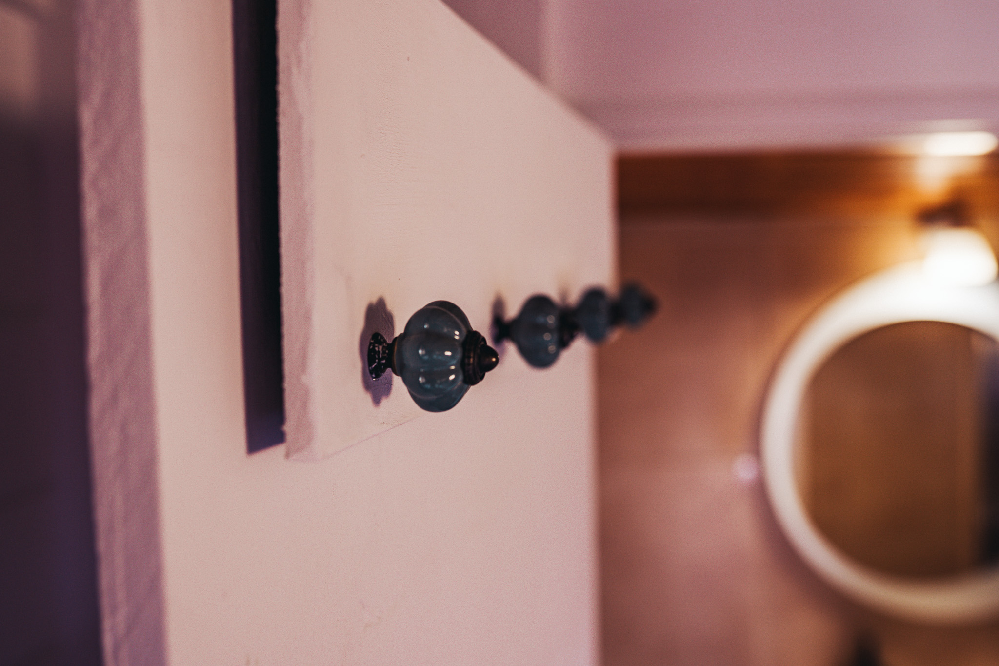 Cabin bathroom wall hooks and mirror