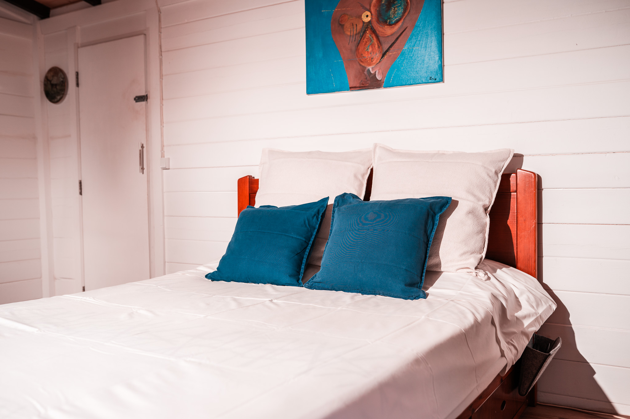 Cabin bed with blue pillows